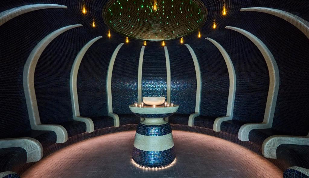 a room with a bowl on a pedestal with lights at Rudding Park in Harrogate