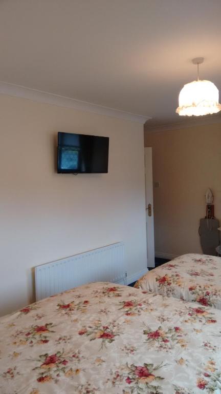 Postel nebo postele na pokoji v ubytování Corrib View Guesthouse h91rr72