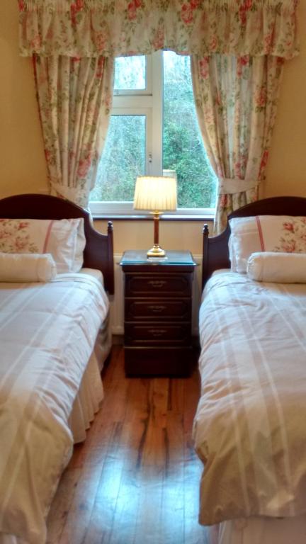 Postel nebo postele na pokoji v ubytování Corrib View Guesthouse h91rr72