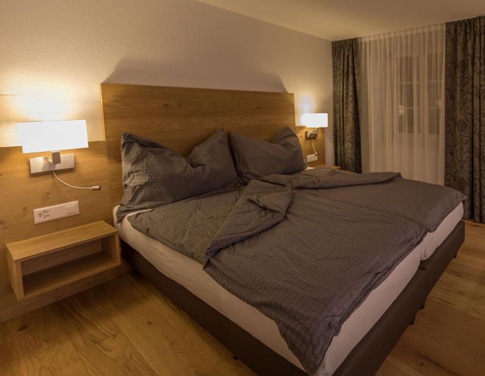 Postel nebo postele na pokoji v ubytování Gasthaus Rössli