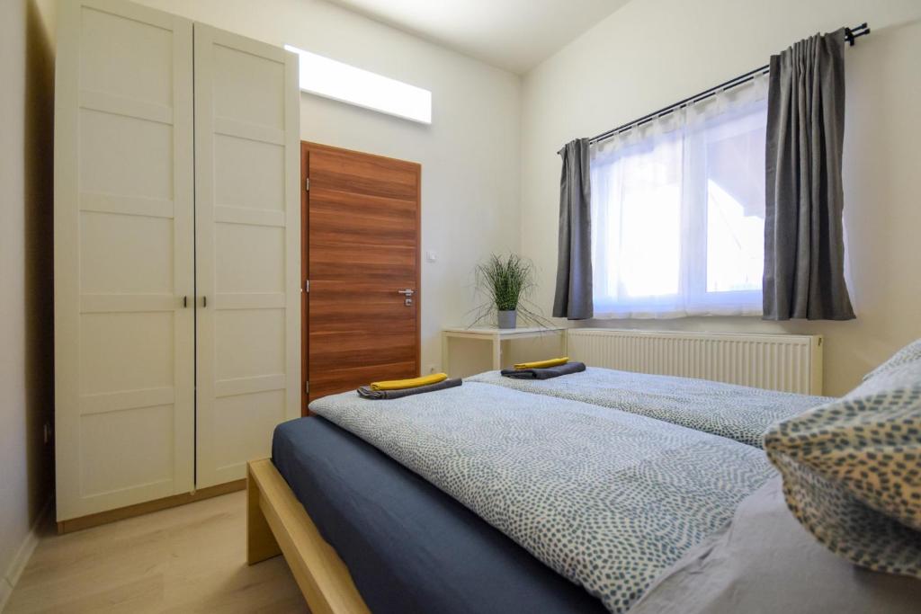 Posteľ alebo postele v izbe v ubytovaní Island Apartment Budapest