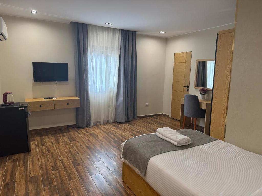 Postel nebo postele na pokoji v ubytování Dyafa Pyramids Hotel & Spa