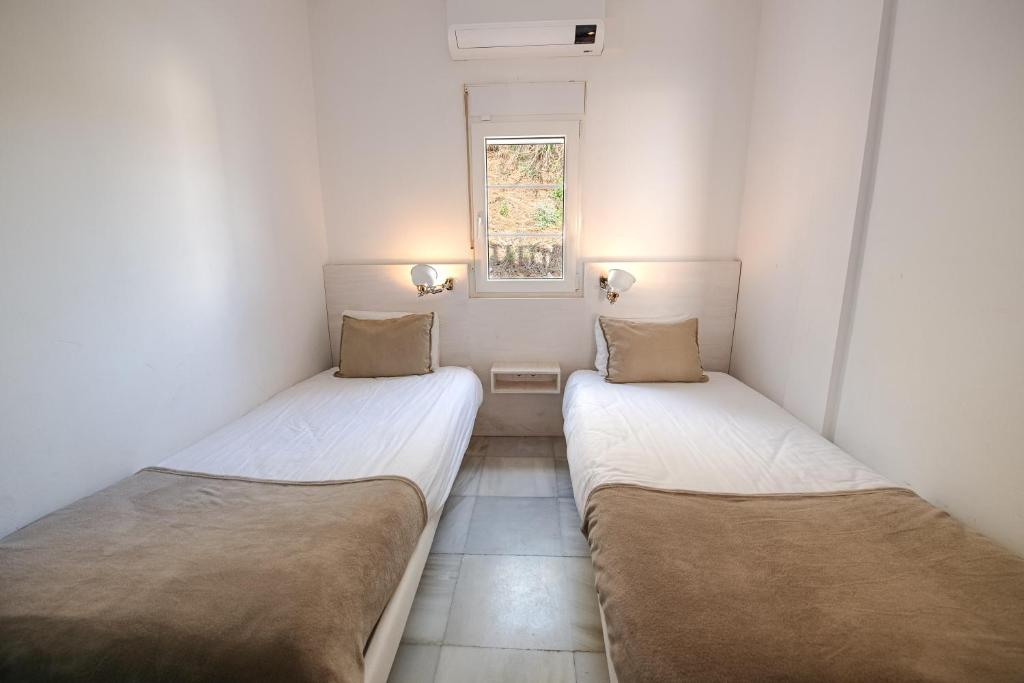 Posteľ alebo postele v izbe v ubytovaní Gran villa con vistas al mar y piscina privada