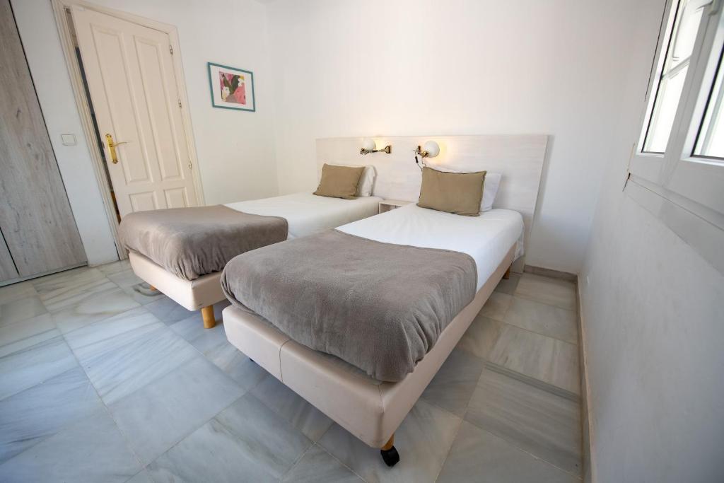Posteľ alebo postele v izbe v ubytovaní Gran villa con vistas al mar y piscina privada