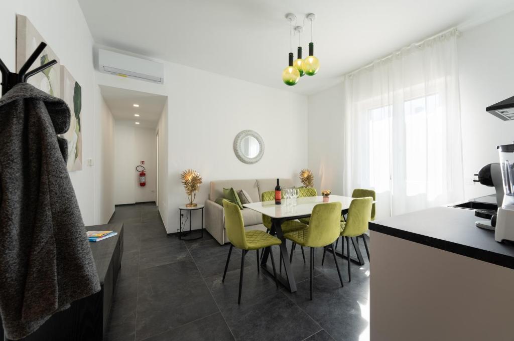 a kitchen and dining room with a table and chairs at Rinascimento Apartments in Florence