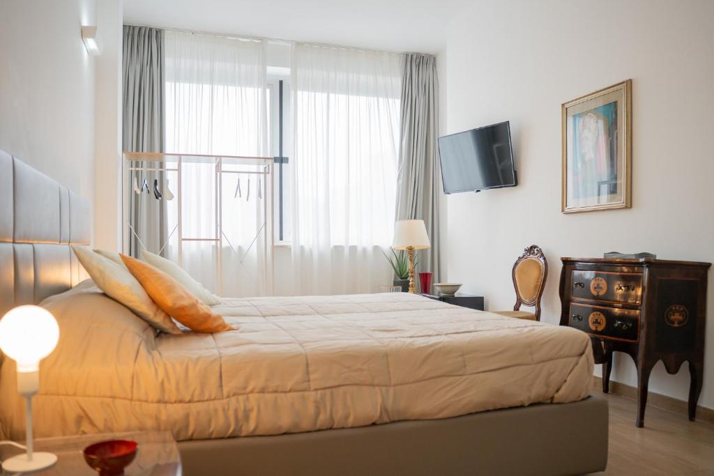 Postel nebo postele na pokoji v ubytování B&B Charme