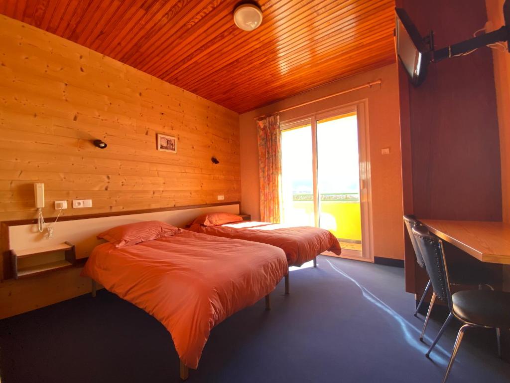 Postel nebo postele na pokoji v ubytování Relais du Belloch