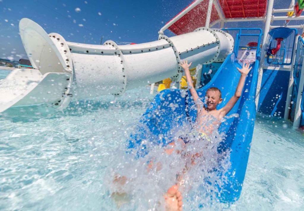 a boy on a water slide in the water at Mobilehomes in Umag - Istrien 11967 in Umag