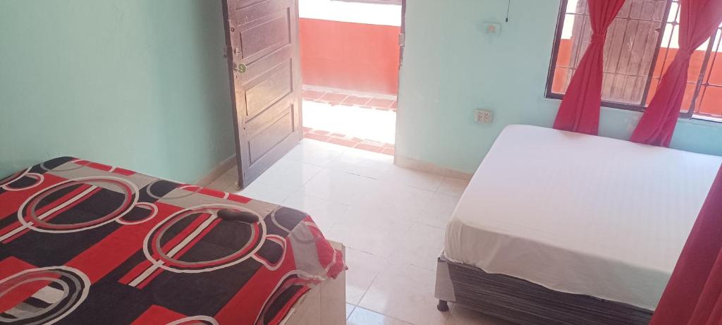 Letto o letti in una camera di Hostal Amanecer del Valle