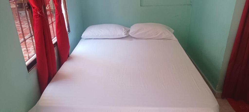 Letto o letti in una camera di Hostal Amanecer del Valle