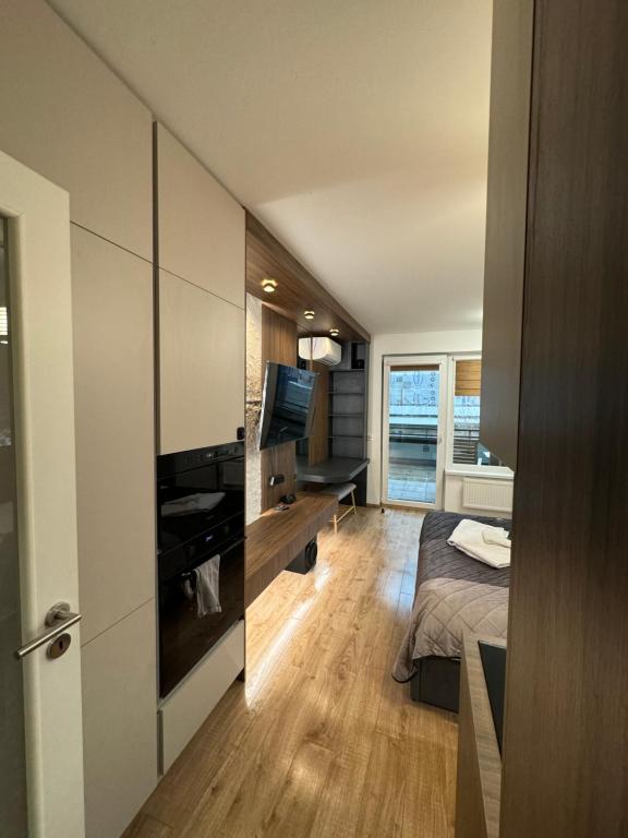 a bedroom with a bed and a television in a room at AH Luxury Radnica Spa in Košice