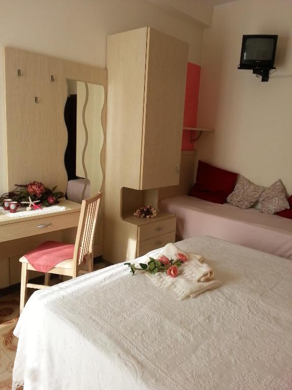 Postel nebo postele na pokoji v ubytování Hotel Maxim