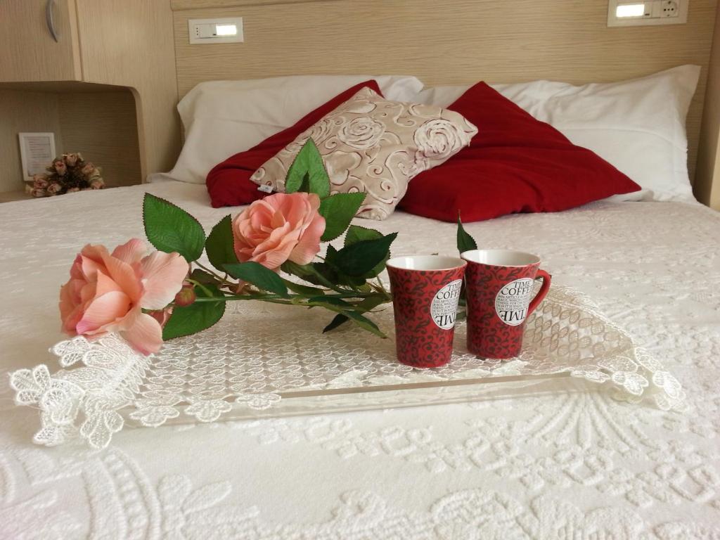 Postel nebo postele na pokoji v ubytování Hotel Maxim