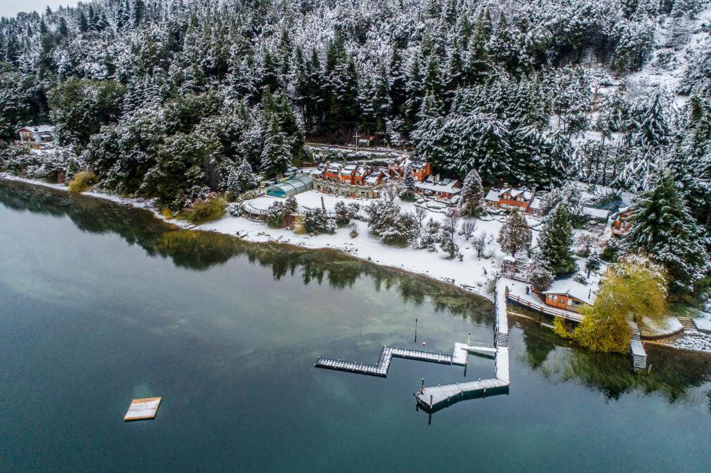 an aerial view of a resort in the snow at Cabañas Puerto Pireo in San Carlos de Bariloche
