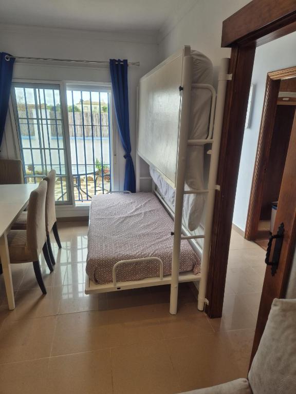 Postel nebo postele na pokoji v ubytování MYKONOS entre cepas