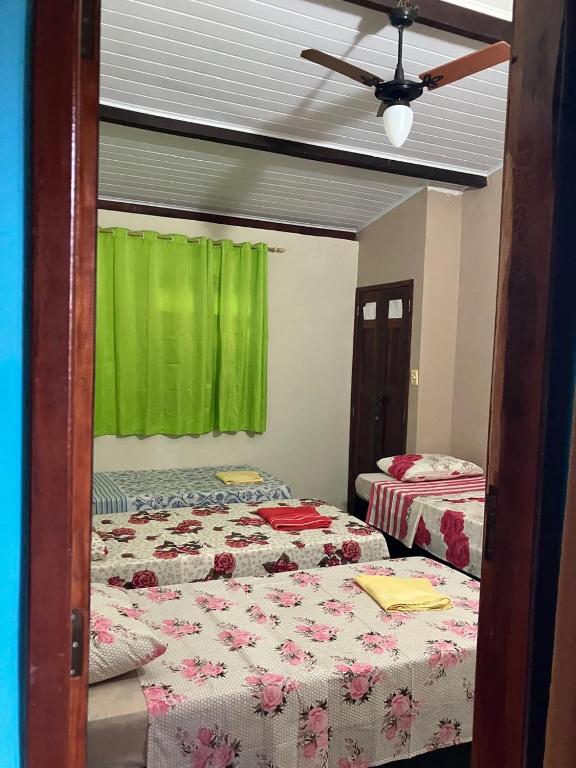 Postel nebo postele na pokoji v ubytování Hospedagem da Miss