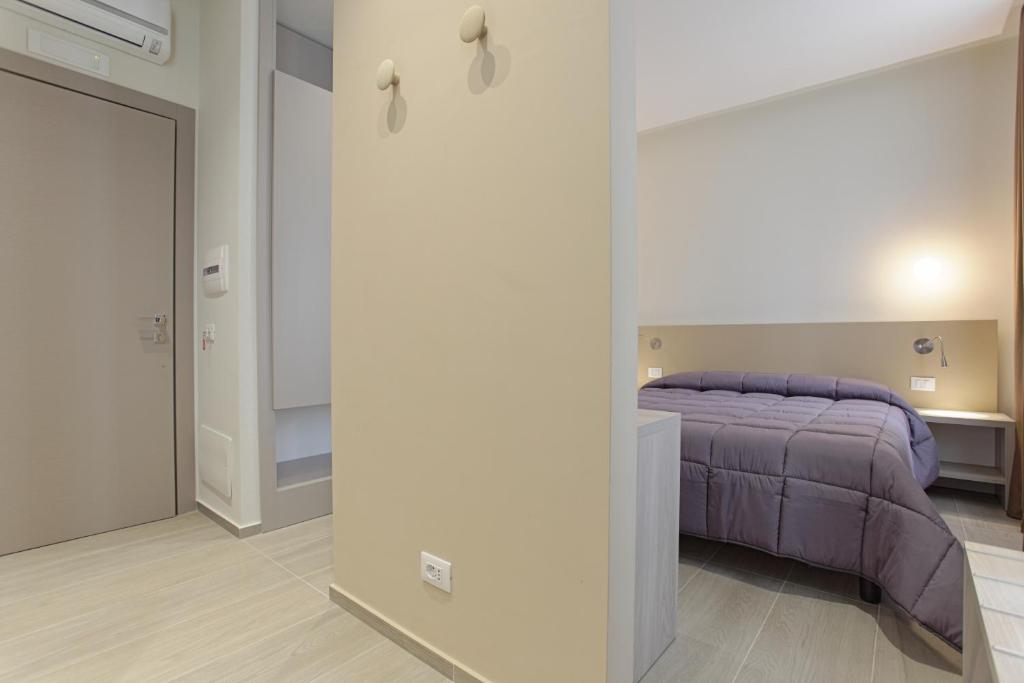 Postel nebo postele na pokoji v ubytování Hotel Agrigento Home