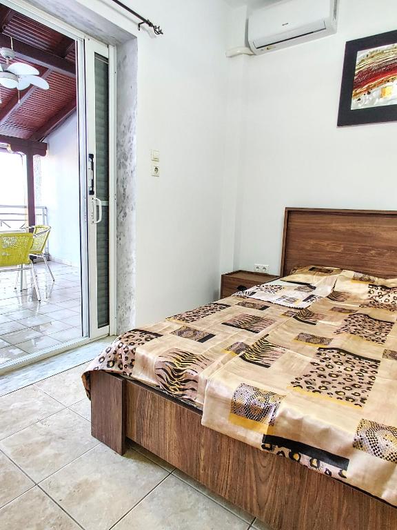 Postel nebo postele na pokoji v ubytování FLOGITA - 5 Beautiful Apartments