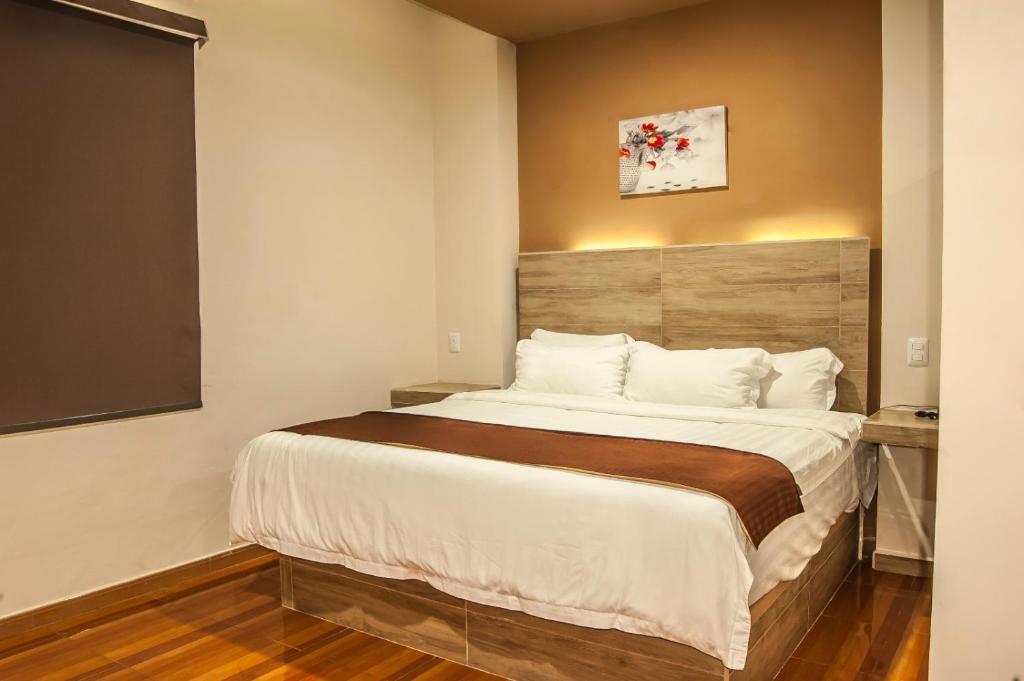 Postel nebo postele na pokoji v ubytování Hotel Luna Caribe
