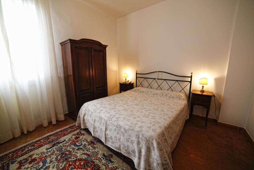 Łóżko lub łóżka w pokoju w obiekcie Hotel Luna