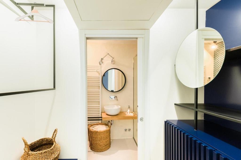 a bathroom with a mirror and a sink at Casa Tusci Amalfi Sea View Duomo Ferry to Positano in Amalfi