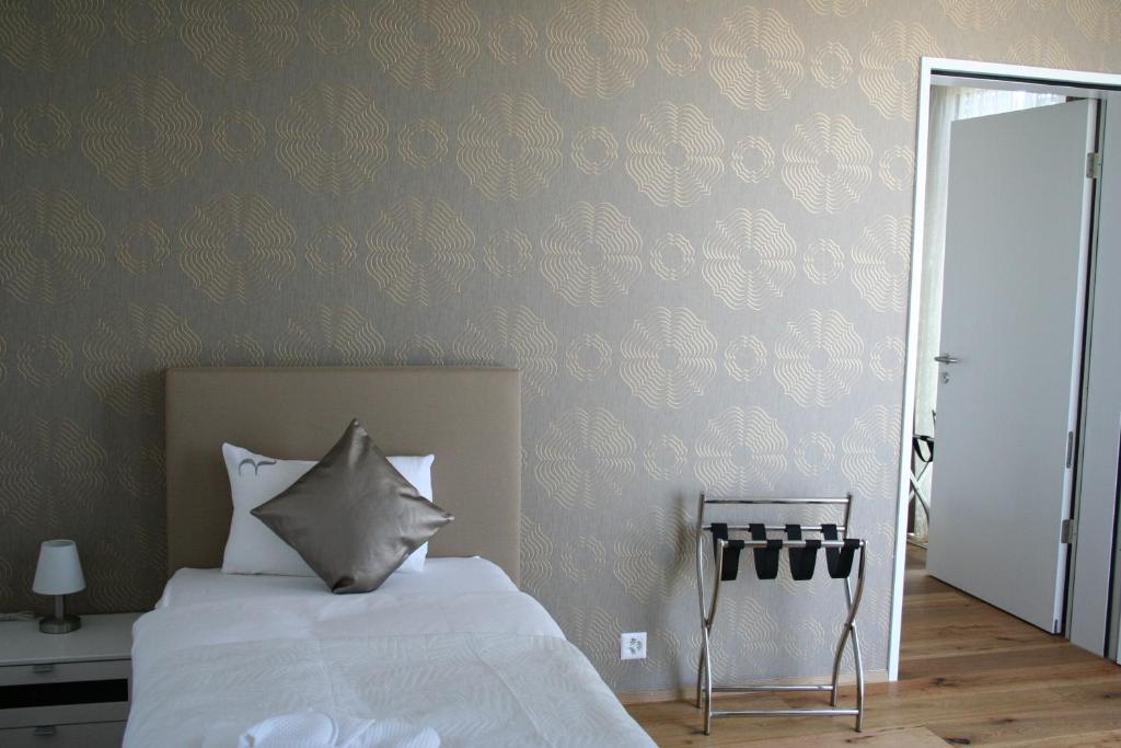 Postel nebo postele na pokoji v ubytování Residence Appartements