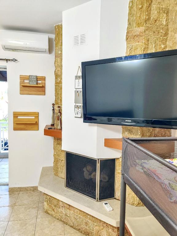 TV a/nebo společenská místnost v ubytování FLOGITA - 5 Beautiful Apartments