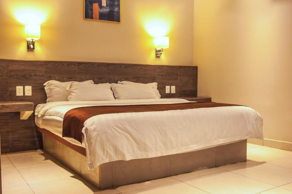 Postel nebo postele na pokoji v ubytování Hotel Luna Caribe
