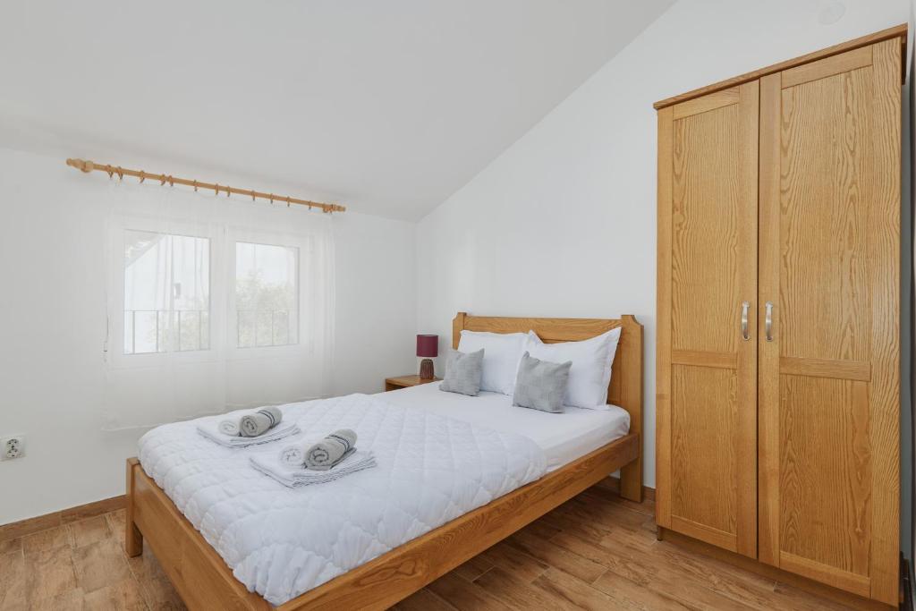 Postel nebo postele na pokoji v ubytování Rosic Apartments Baosici