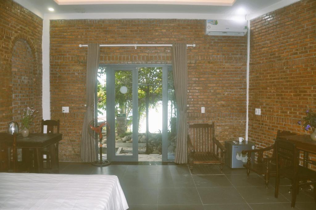 Postel nebo postele na pokoji v ubytování Autumn Bay Retreat Hoi An