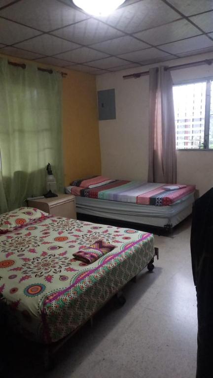 A bed or beds in a room at PaCasa Hostel