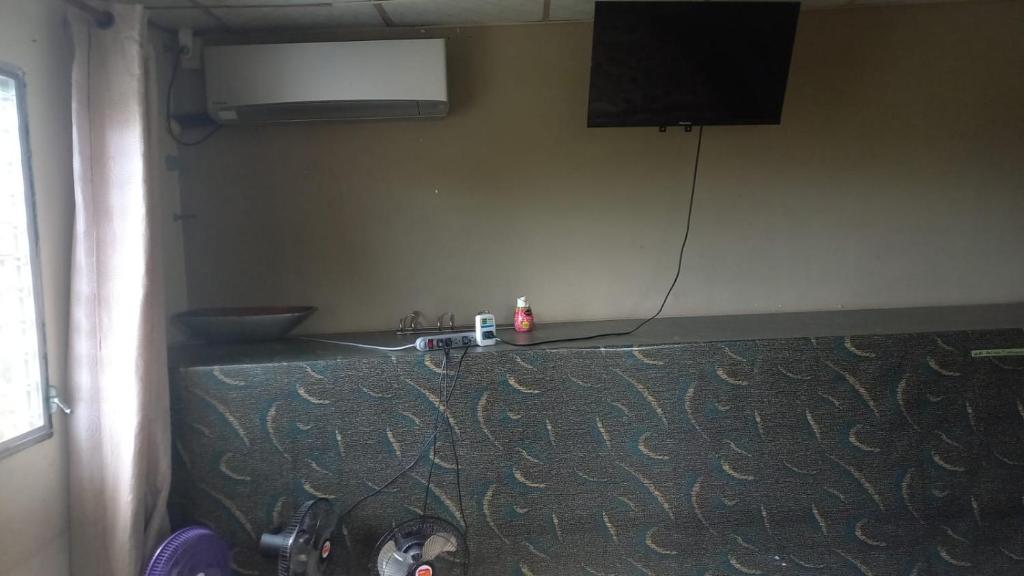 A television and/or entertainment centre at PaCasa Hostel