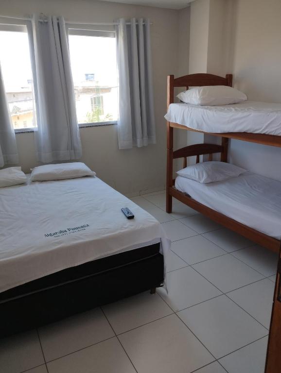 Postel nebo postele na pokoji v ubytování Hotel Algaroba Anexo