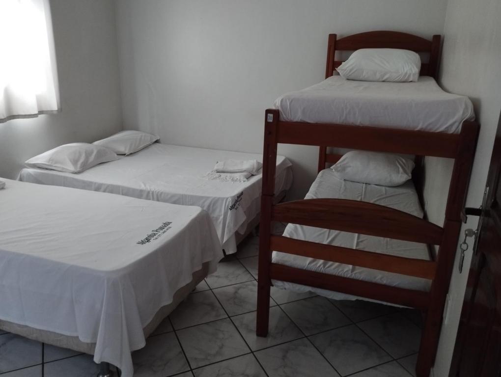 Postel nebo postele na pokoji v ubytování Hotel Algaroba Anexo