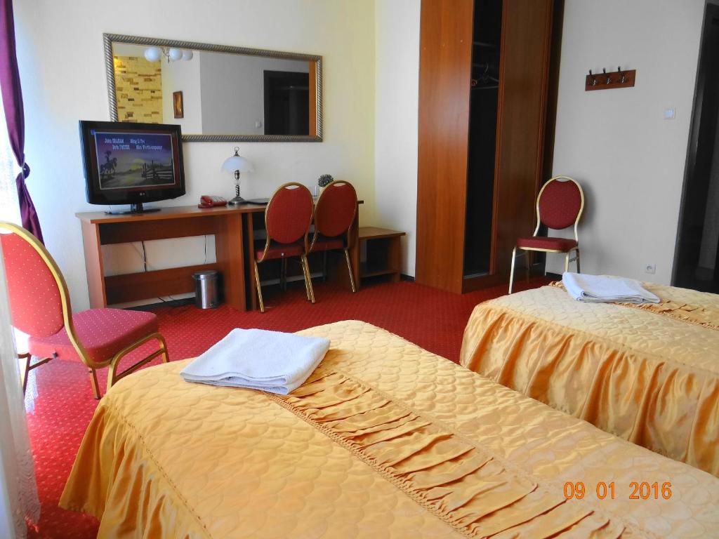 Posteľ alebo postele v izbe v ubytovaní Hotel Sekwana