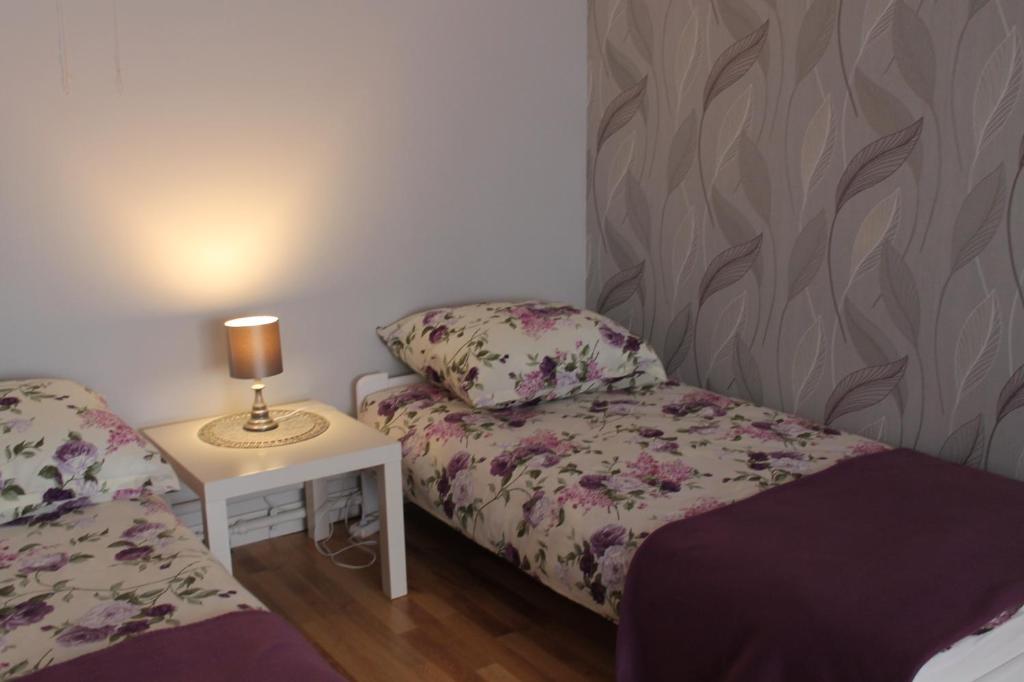 Postel nebo postele na pokoji v ubytování Apartament u Marzenki