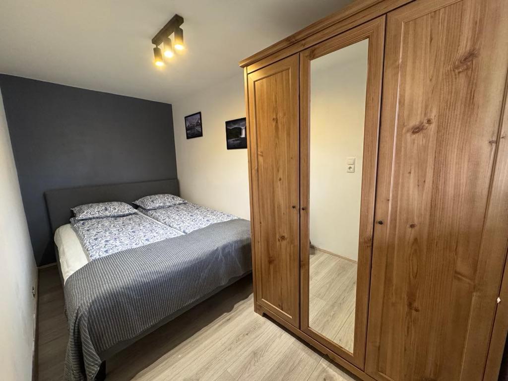 Postel nebo postele na pokoji v ubytování Aurora cozy Apartments