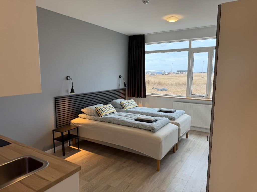 Postel nebo postele na pokoji v ubytování Ocean Breeze Apartments