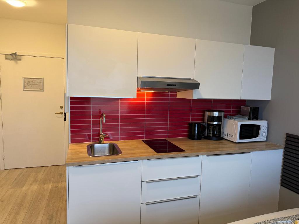 Kuchyň nebo kuchyňský kout v ubytování Ocean Breeze Apartments