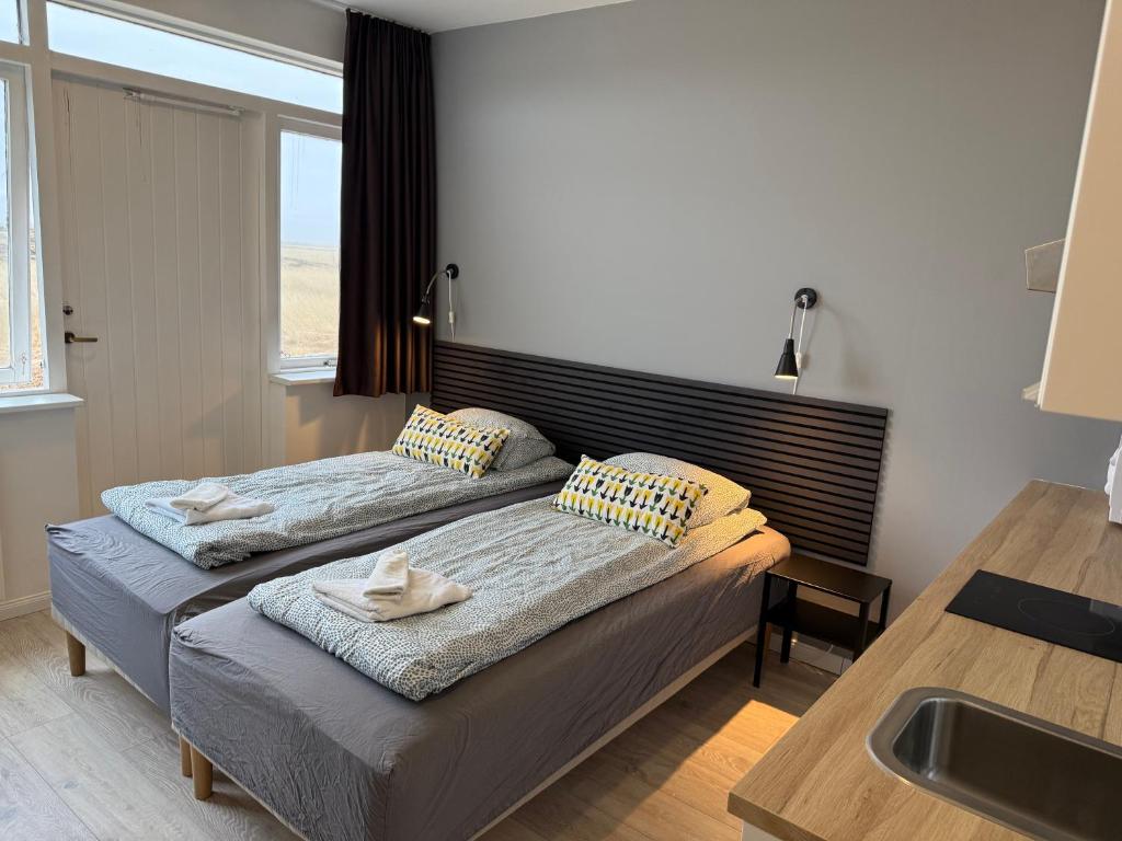 Postel nebo postele na pokoji v ubytování Ocean Breeze Apartments