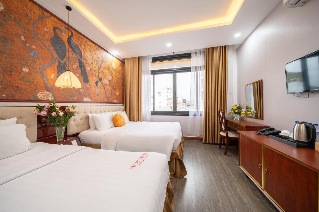 Giường trong phòng chung tại Thuy Duong Boutique Hotel Hue