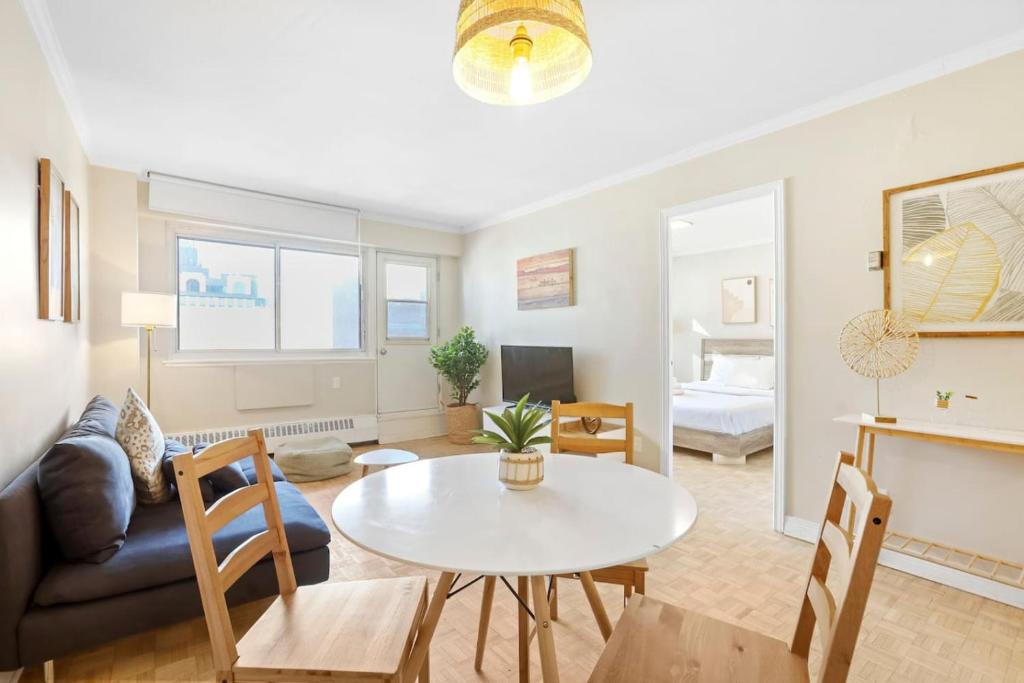 a living room with a table and a couch at Central 1bedroom apartment in Montréal
