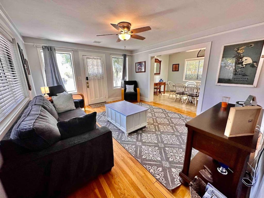 a living room with a couch and a table at The Virginia Blue- Walk To Downtown Prescott in Prescott