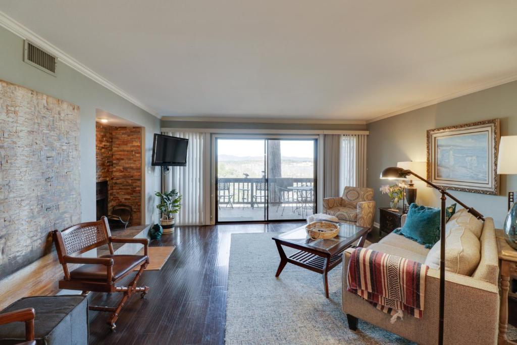 a living room with a couch and a table at Hot Springs Condo with Lake Access and Community Pool in Hot Springs