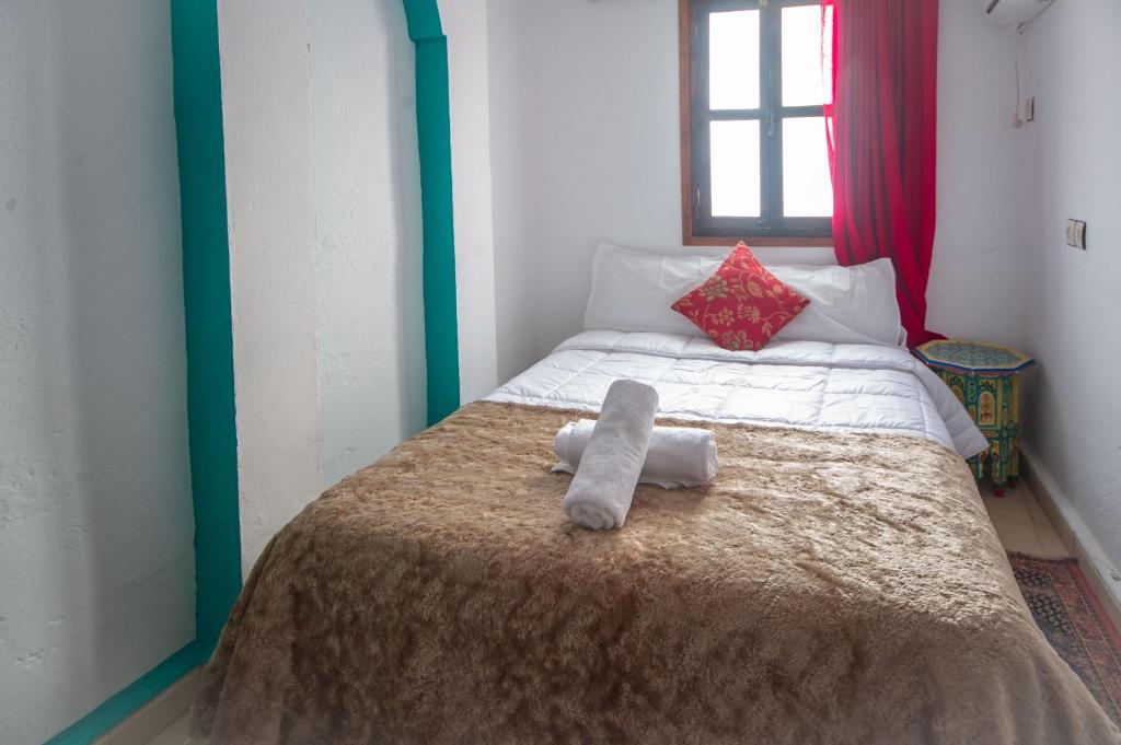 Postel nebo postele na pokoji v ubytování Riad Dar Chourafa