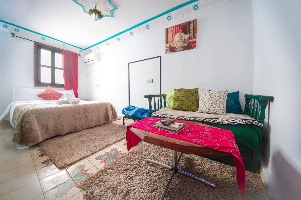 Postel nebo postele na pokoji v ubytování Riad Dar Chourafa