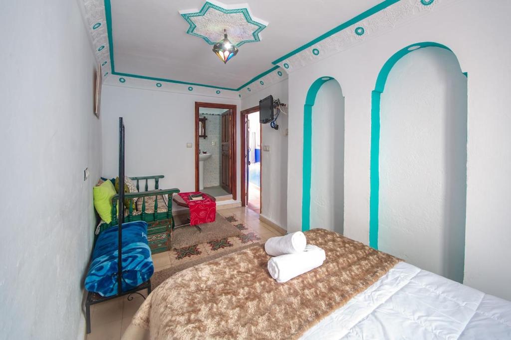Postel nebo postele na pokoji v ubytování Riad Dar Chourafa