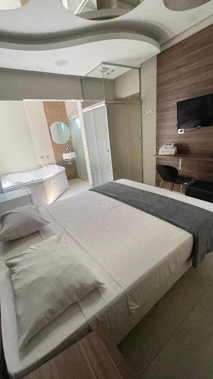 Postel nebo postele na pokoji v ubytování ADD HOTÉIS Center Norte