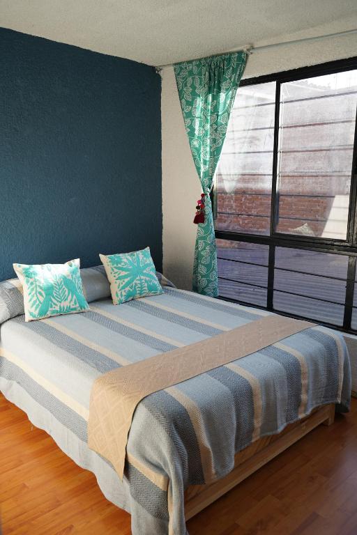 Postel nebo postele na pokoji v ubytování Casa compartida centro histórico