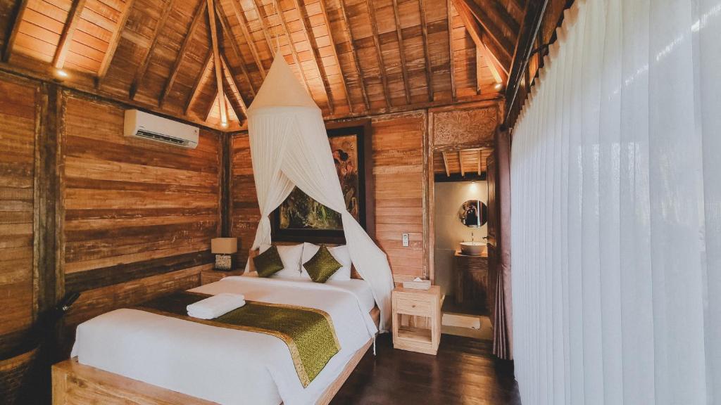 Postel nebo postele na pokoji v ubytování Aura Guesthouse